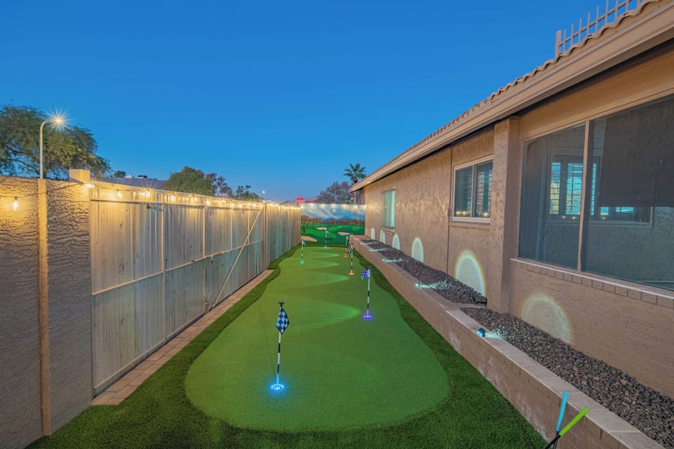 Private 6-hole putting green, beautifully lit for evening family fun
