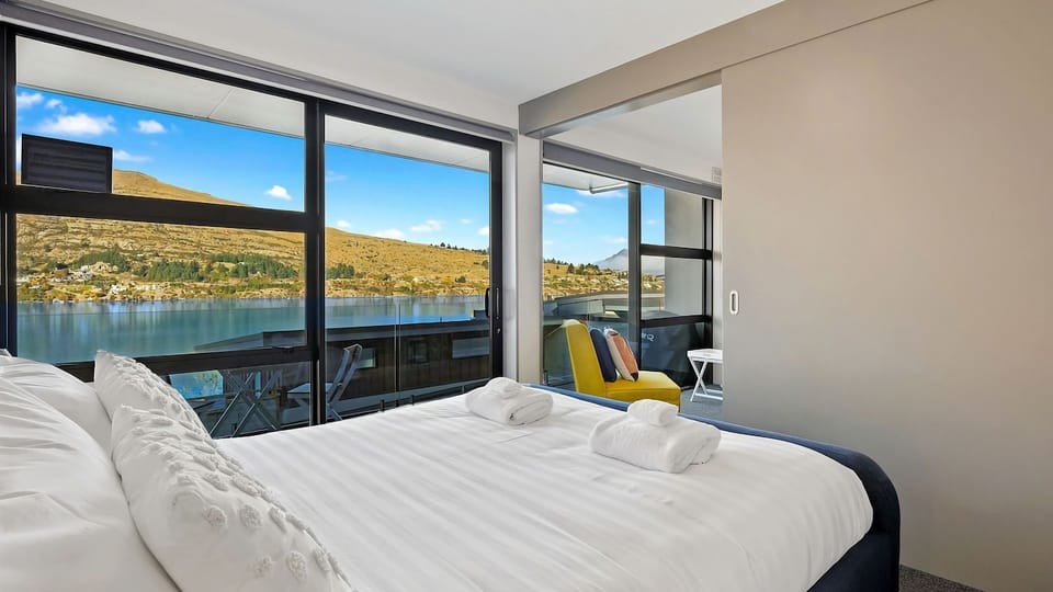 The bedroom boasts world class lake and mountain views enjoyed from the comfort of the bed.