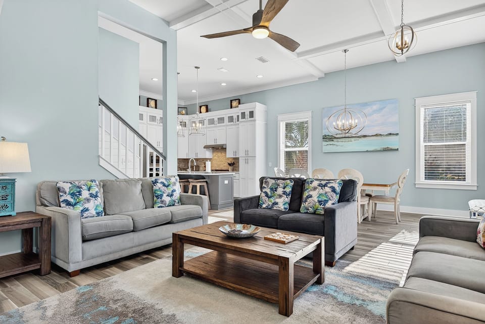 Bright, open living space with coastal décor and plenty of room to unwind together.