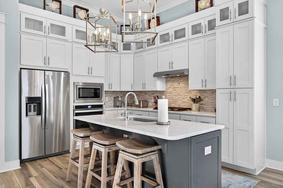 Bright, modern kitchen with stainless appliances and a spacious island for gathering.