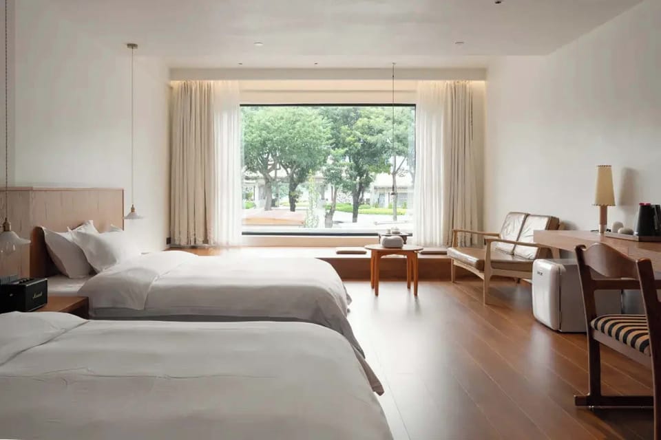Comfort Twin Room, Courtyard View | Living area | TV