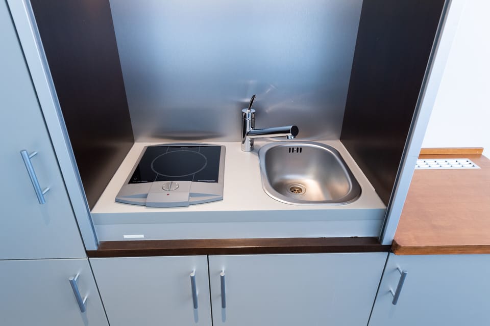 Suite, 1 Bedroom | Living area | 20-inch LCD TV with cable channels, TV, pay movies