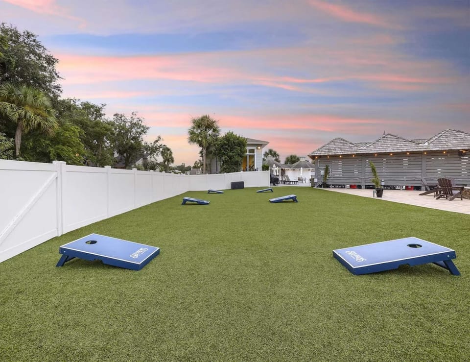 Wide view of game lawn set for outdoor fun at sunset