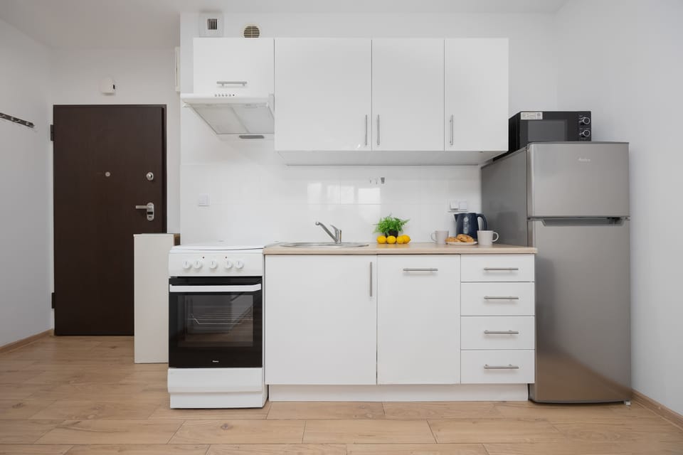 The fully equipped kitchenette includes everything you need for a home-cooked meal.