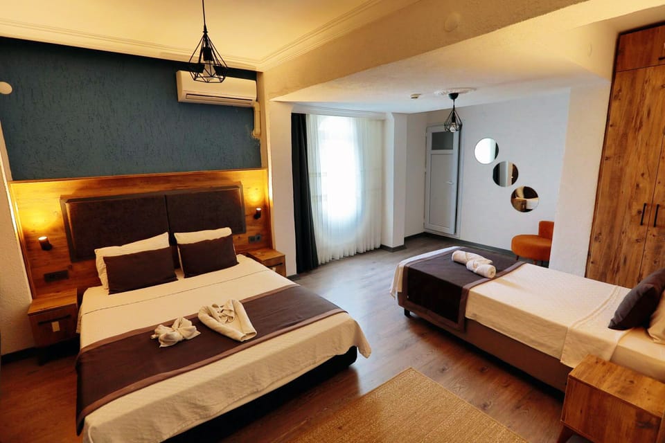 Classic Triple Room, Garden View | Desk, laptop workspace, free WiFi, bed sheets