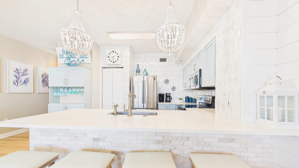 Kitchen has breakfast bar with barstool seating for 4