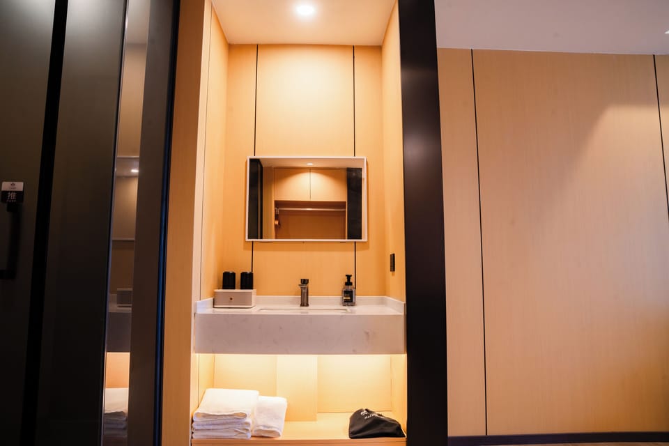 Separate tub and shower, rainfall showerhead, hair dryer, slippers