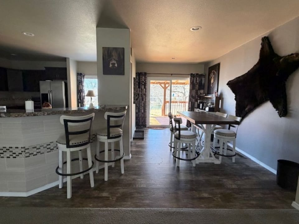 Dining Room, Kitchen Island, Sliding Door to Deck Overlooking San Juan River