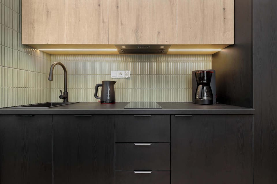 The fully equipped kitchenette includes everything you need for a home-cooked meal.