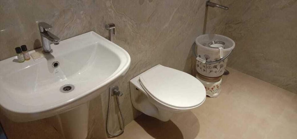 Shower, slippers, towels, soap