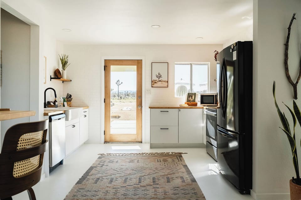 Light-filled kitchen with desert views—perfect for full meals or warming up takeout.
