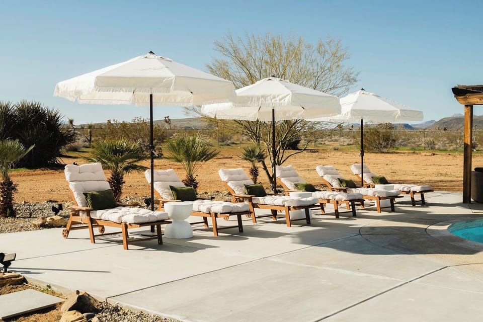 Plush loungers, cool shade, desert views—perfect rest after a day of hiking.
