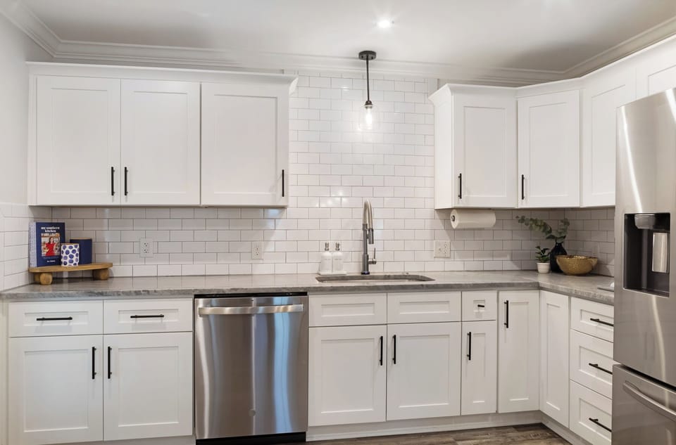 Plenty of counter space with a deep sink and dishwasher for easy cleanup.