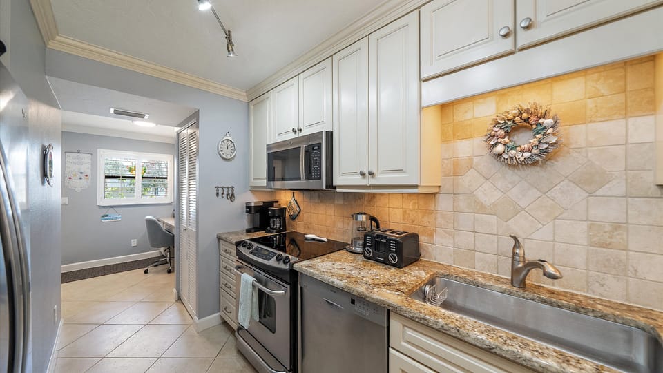 Your fully equipped kitchen features granite countertops, stainless steel appliances, and all the essentials you need to prepare meals during your stay.