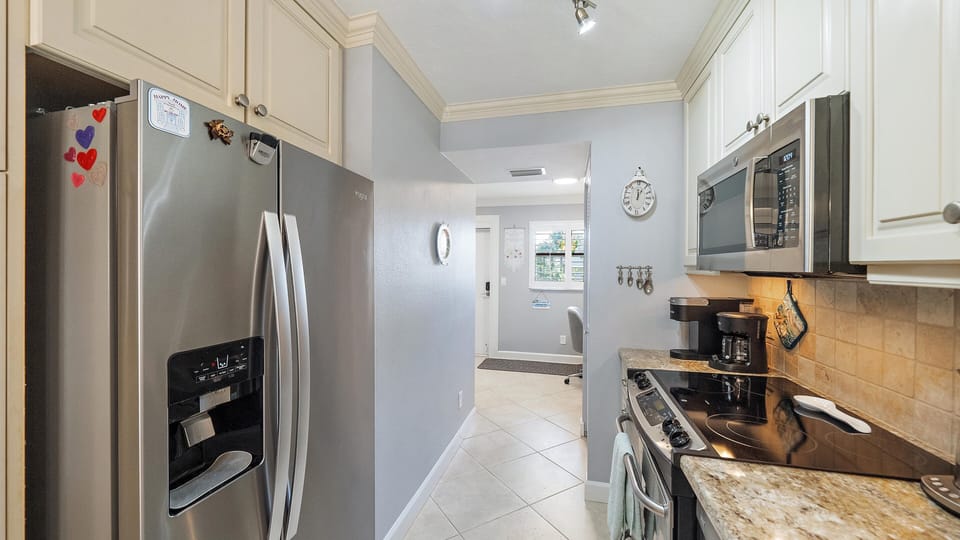 Your fully equipped galley kitchen features granite countertops, stainless steel appliances, and everything you need to prepare meals during your stay.