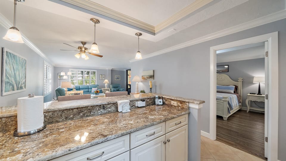 Your open-concept kitchen features stunning granite countertops and flows seamlessly into the living area, with your private bedroom suite just steps away.