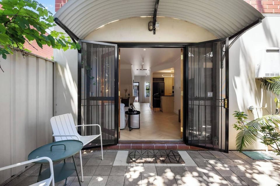 The private courtyard offers a leafy nook for morning coffee or quiet reflection.
