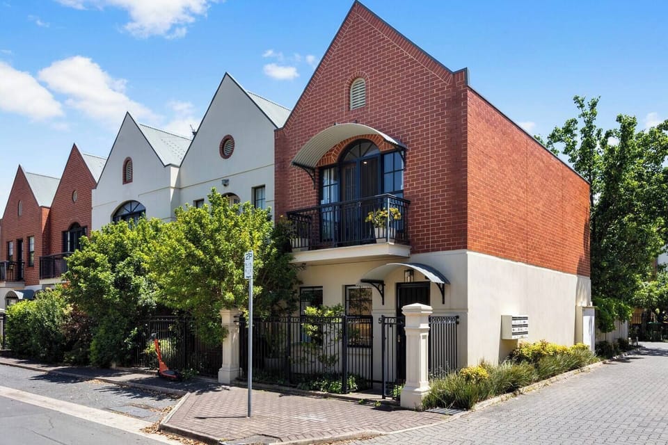 The heritage-inspired façade sets a welcoming first impression, complemented by secure garage parking directly on-site.