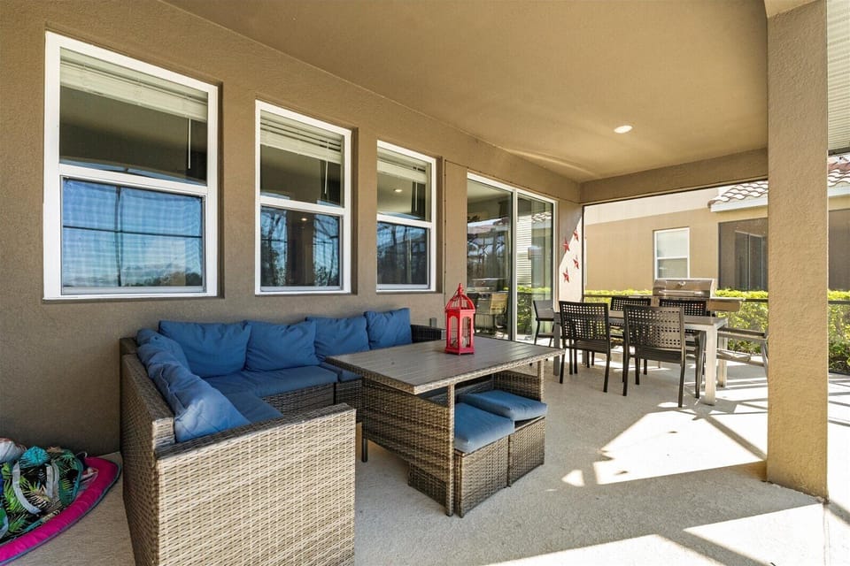 Patio with outdoor dining area and bbq grill