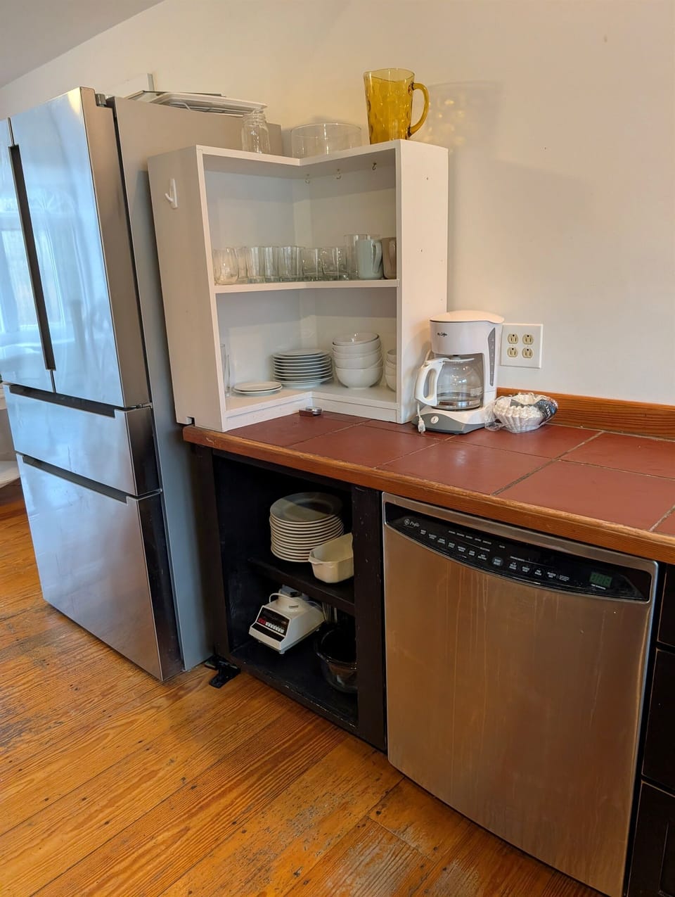 Fully equipped kitchen with dishwasher and stocked cabinets for easy meal prep and cleanup.