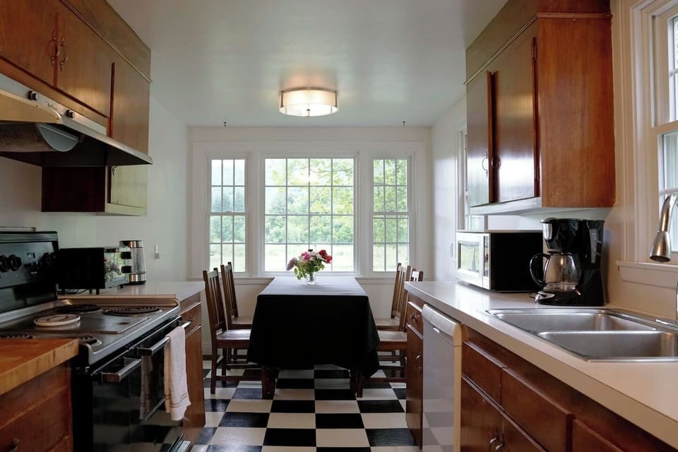 Kitchen with industrial stove dishwasher, coffee maker,and all necessary items to produce a great meal 