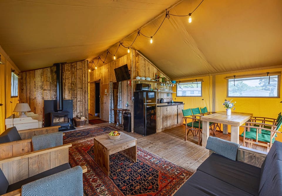 Spacious open-plan kitchen, dining and sitting area with a log burner