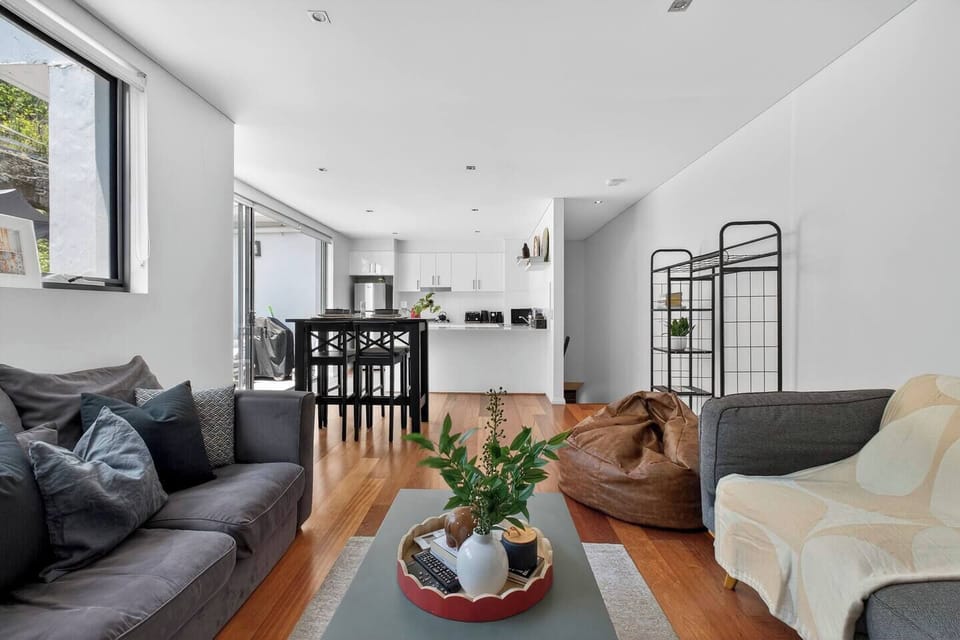 The open-plan layout creates easy connection, with the lounge, dining area and kitchen flowing together for relaxed cooking and casual time together.