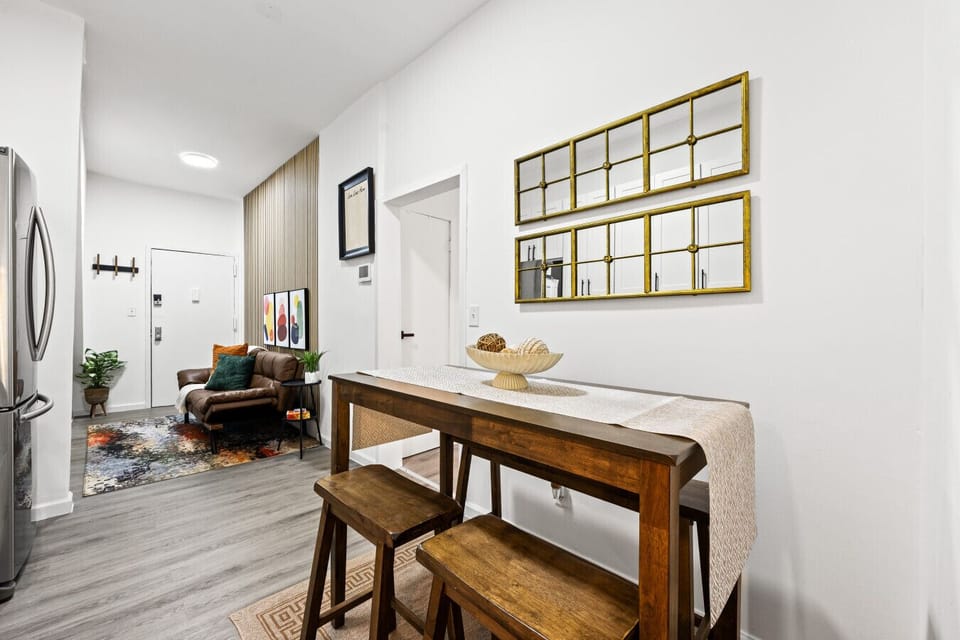 Set just beside the foyer, this cozy table doubles as a dining spot or workspace—an easy, welcoming place to settle in, enjoy a meal, or plan your day as you come and go.