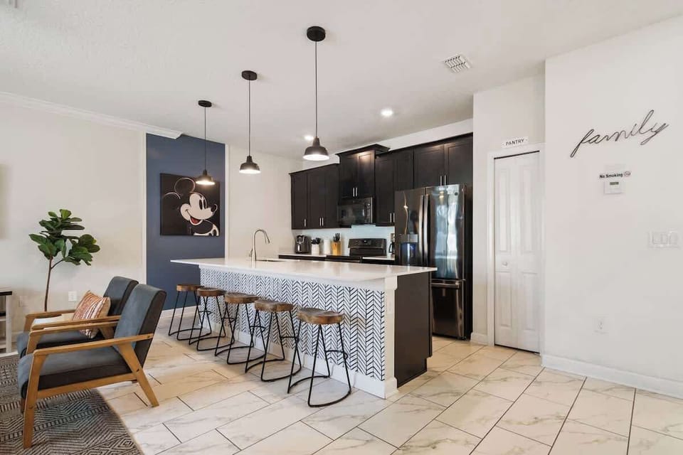 Create unforgettable memories in this stylish kitchen, where shared meals and laughter come naturally. The large island invites everyone to join the fun, making cooking a true family-and-friends experience.