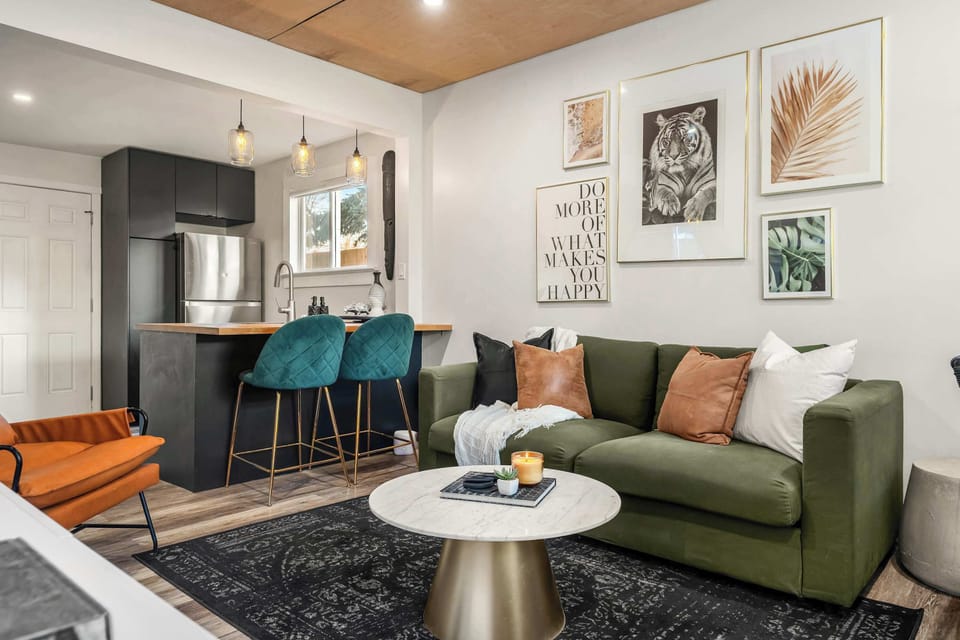 Kitchen, bar seating & lounge all in one view