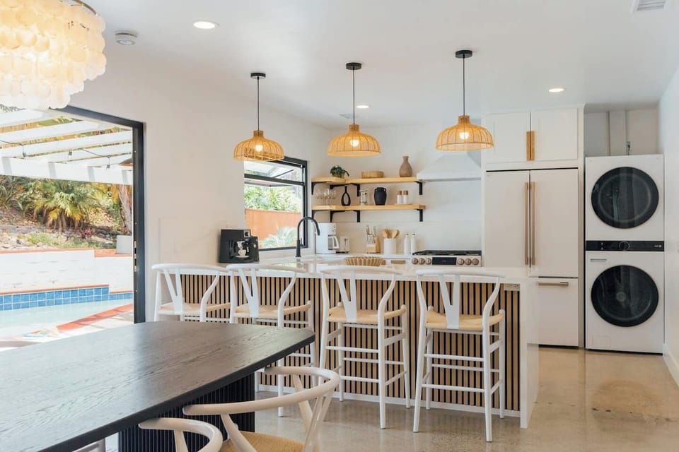 In this fully equipped, modern kitchen, you’ll feel right at home cooking anything your heart desires. With sleek white appliances, ample counter space, and all the essentials, you can prepare meals just like you would in your own kitchen.