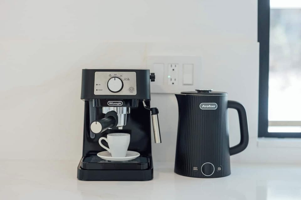 Brew your espresso or drip coffee in the sleek, modern kitchen, fully equipped for cooking and entertaining. Open to the backyard, it's the perfect spot to sip your drink, relax, and enjoy the view—creating the perfect space for unforgettable moments