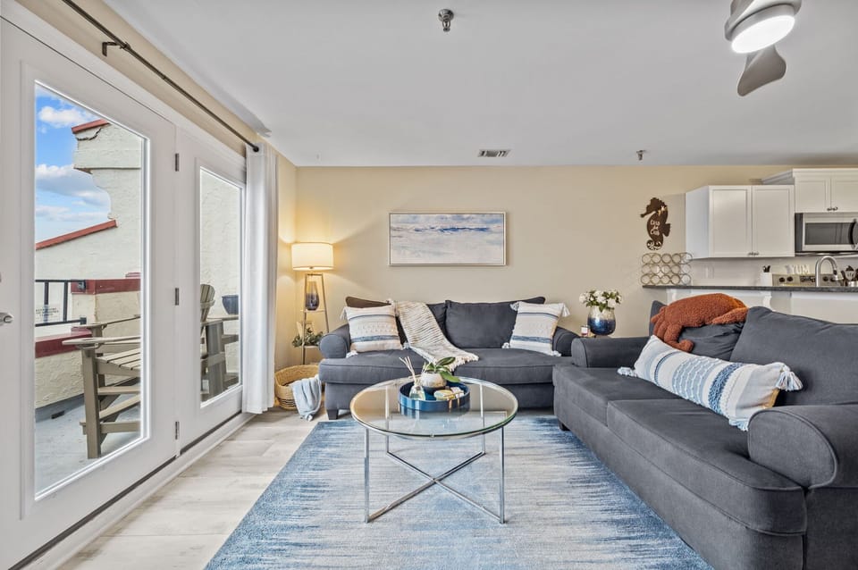 Relax in this spacious living area that opens to the balcony