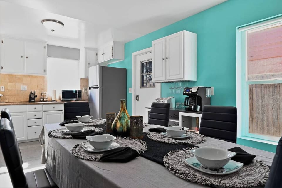 Dining Room: Bright turquoise walls set the stage for memorable meals in style!