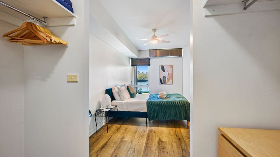 Bright bedroom space with built-in storage and clean design