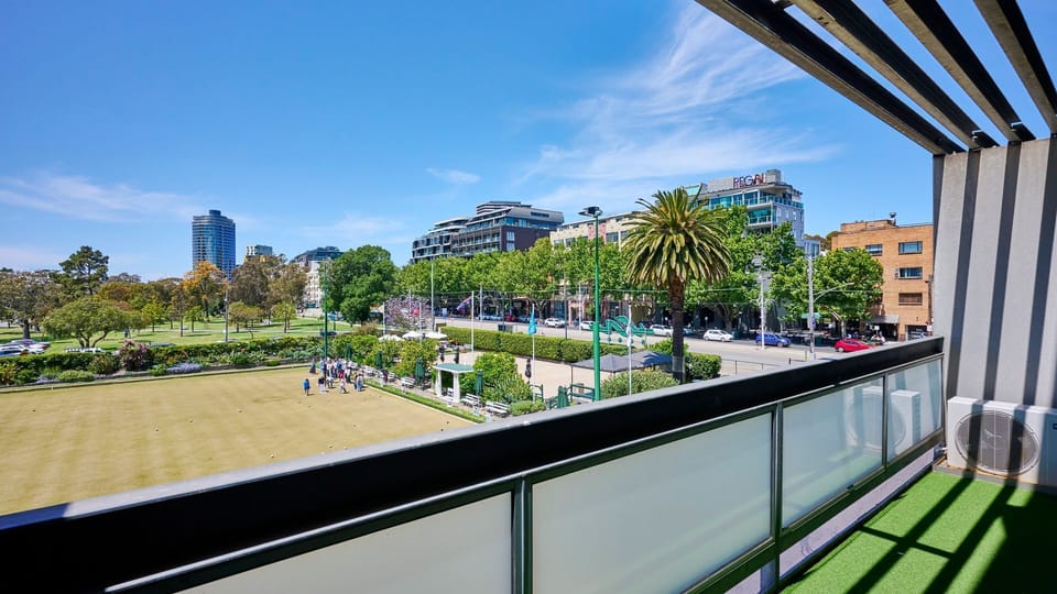 Private balcony overlooking lush parkland—perfect for morning coffee