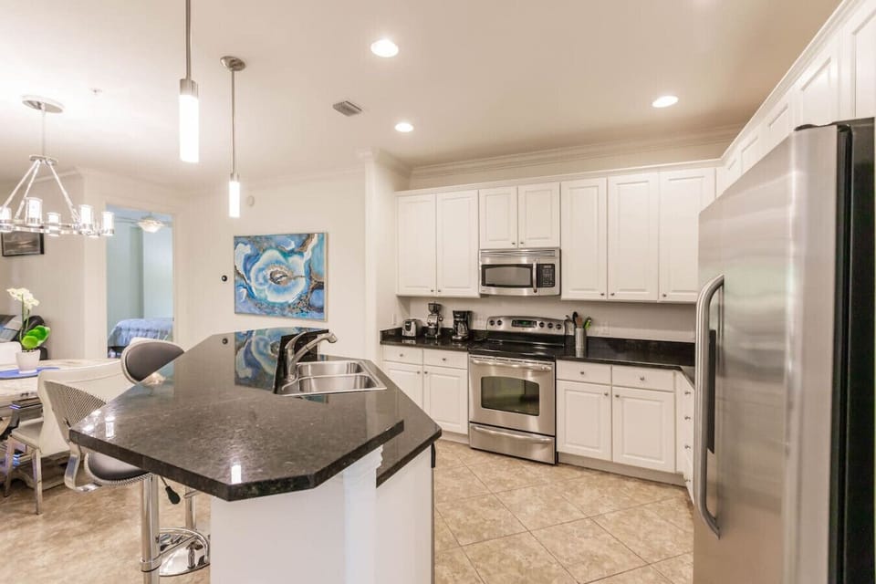 Beautiful black granite counter tops and modern appliances.