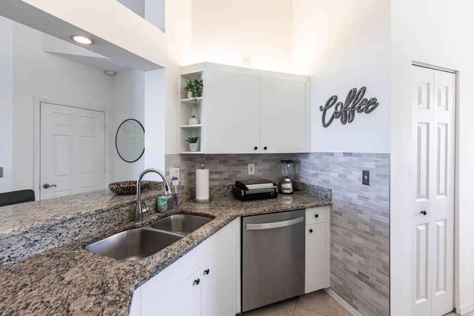 The kitchen has stunning granite counters and plenty of cabinet space.