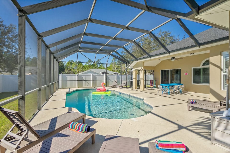 Spacious screened-in pool perfect for relaxing Florida days