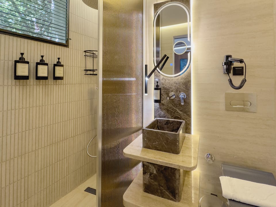 Deluxe Triple Room | Bathroom | Shower, designer toiletries, hair dryer, slippers