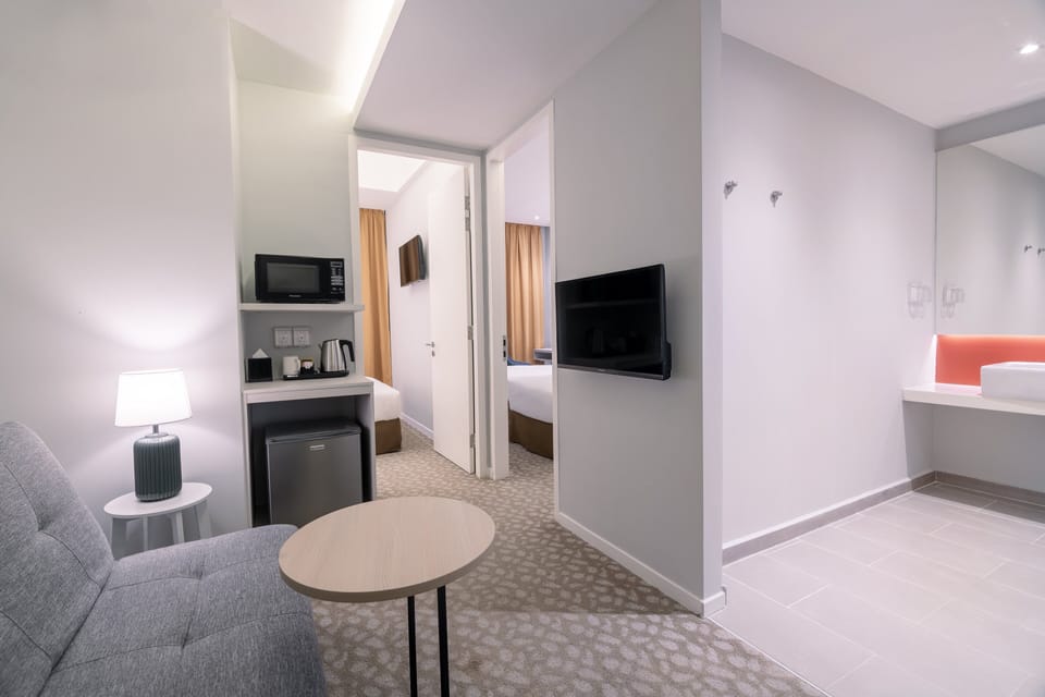 Suite, 2 Bedrooms | In-room safe, desk, blackout drapes, iron/ironing board
