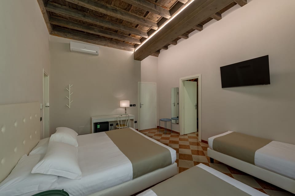 Quadruple Room, 1 Bedroom | In-room safe, desk, cribs/infant beds, rollaway beds