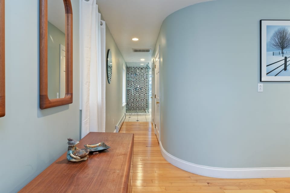 King Master bedroom with lake views and ensuite bathroom with walk in shower