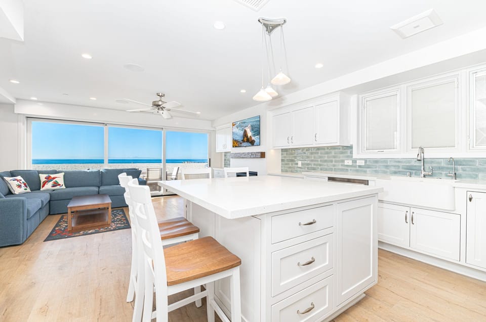 An open layout connects the living space to the kitchen, making it easy to gather, entertain, and enjoy the coastal backdrop
                
