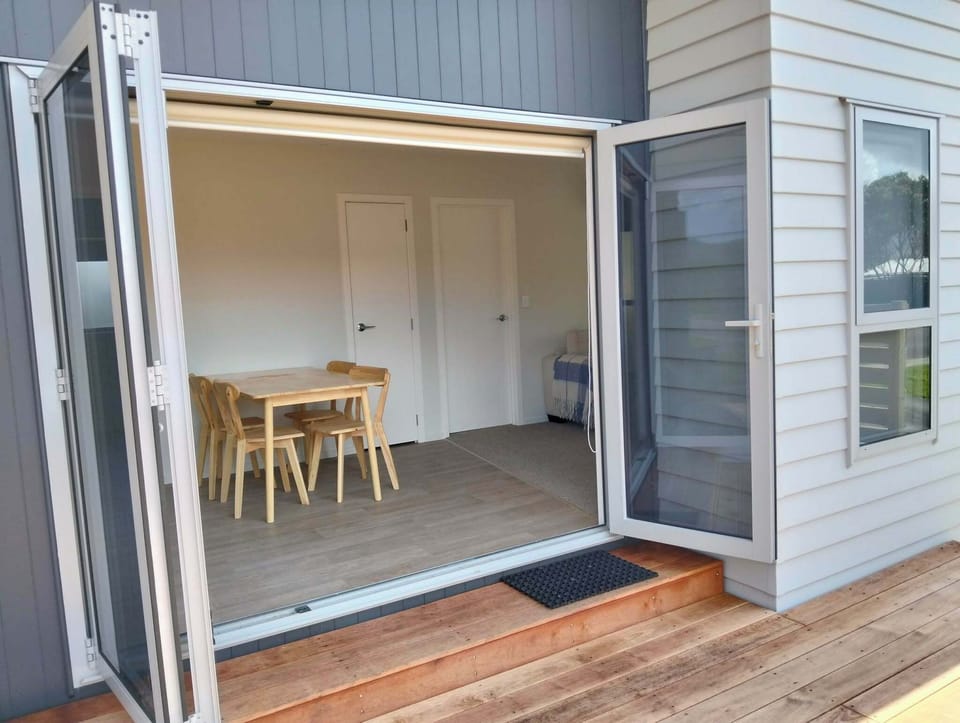 Bifold doors bring the outside in. The beach is 150m away.