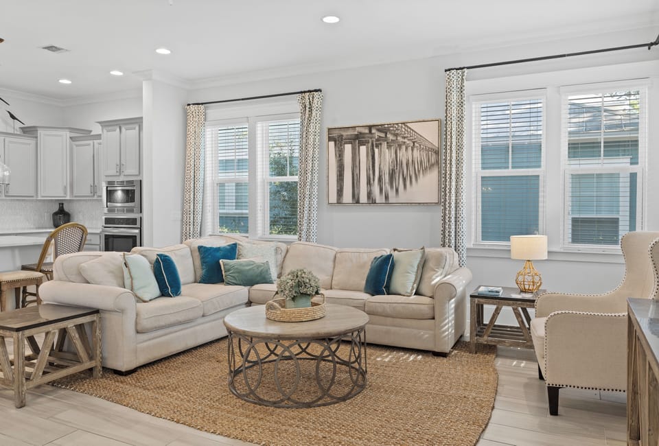 Coastal-themed living room with plush sofa.
