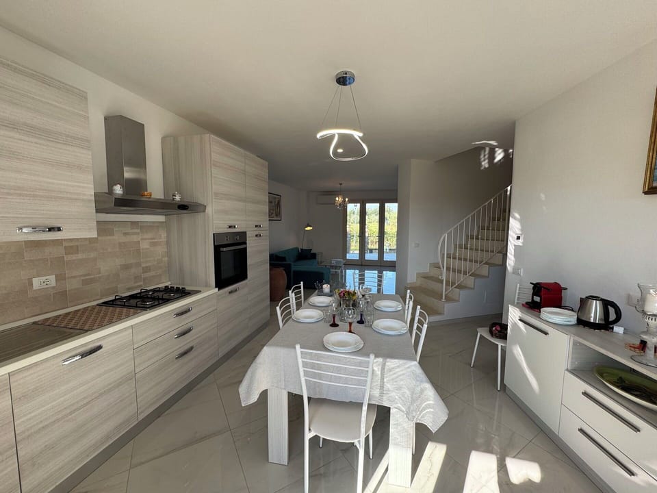 Flooring, Furniture, Floor, Interior Design, Chair, Room, Countertop, Kitchen & Dining Room Table, Apartment, Kitchen