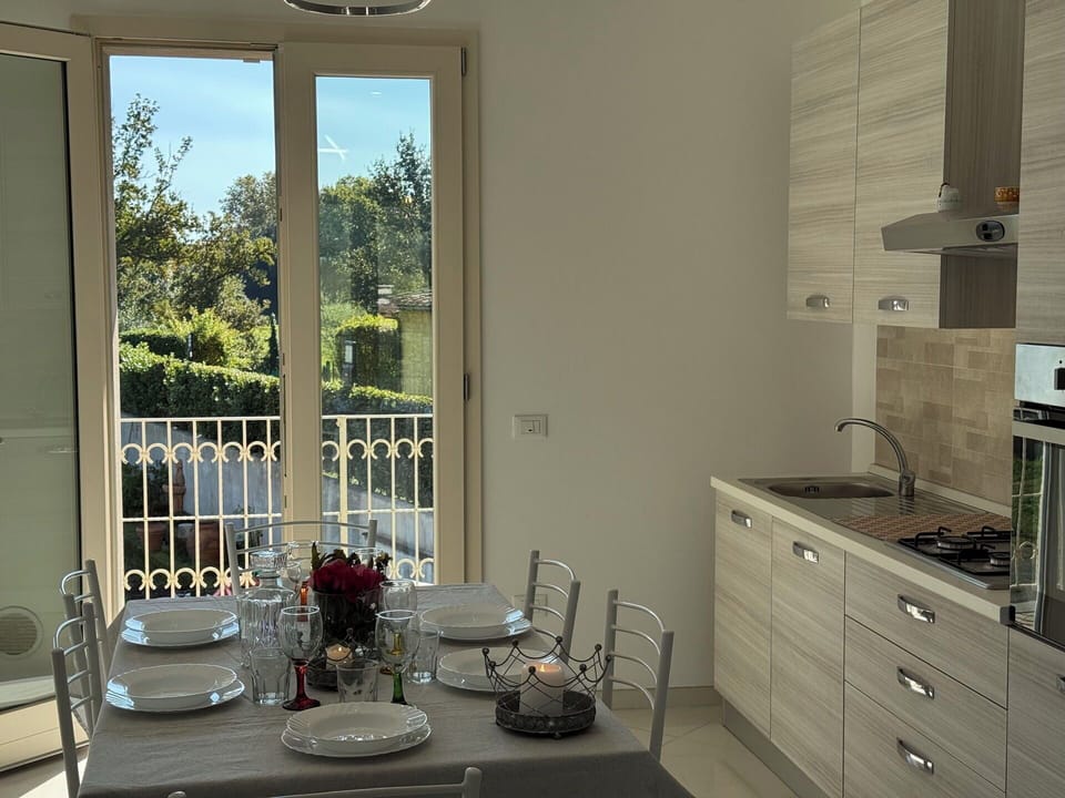 Furniture, Interior Design, Flooring, Wood, Kitchen, Floor, Countertop, Room, Major Appliance, Lighting