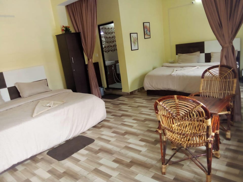 King Room with Two King Beds | Premium bedding, down comforters, Select Comfort beds, in-room safe