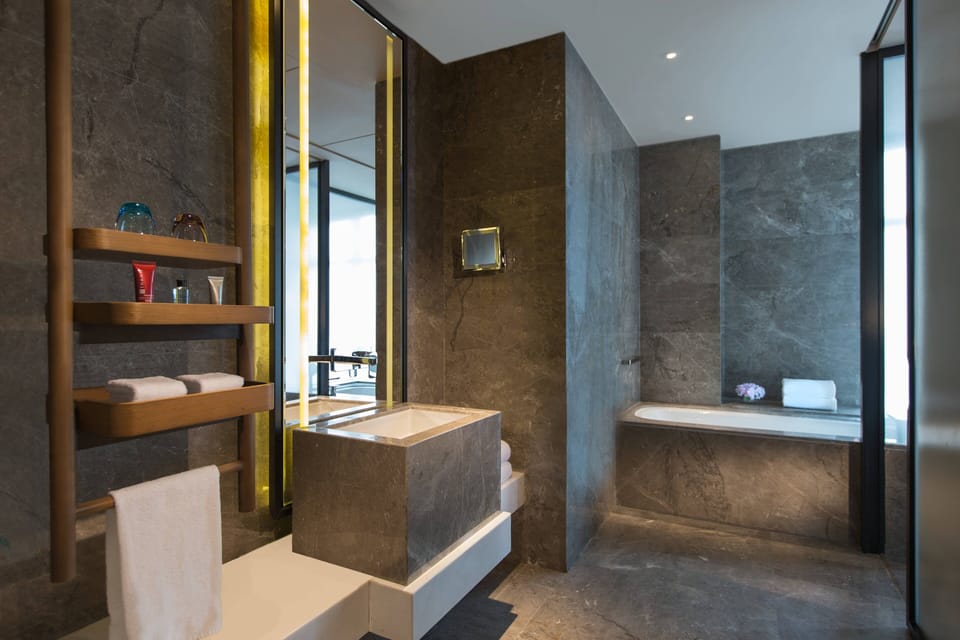 Separate tub and shower, deep soaking tub, designer toiletries